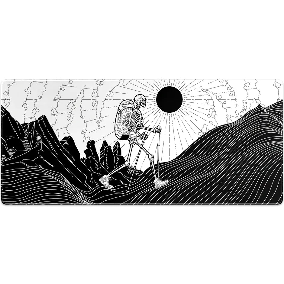 Large ArcaLoot gaming mousepad with a Skeleton figure hiking against a mountain landscape. Bare Boned Expedition.