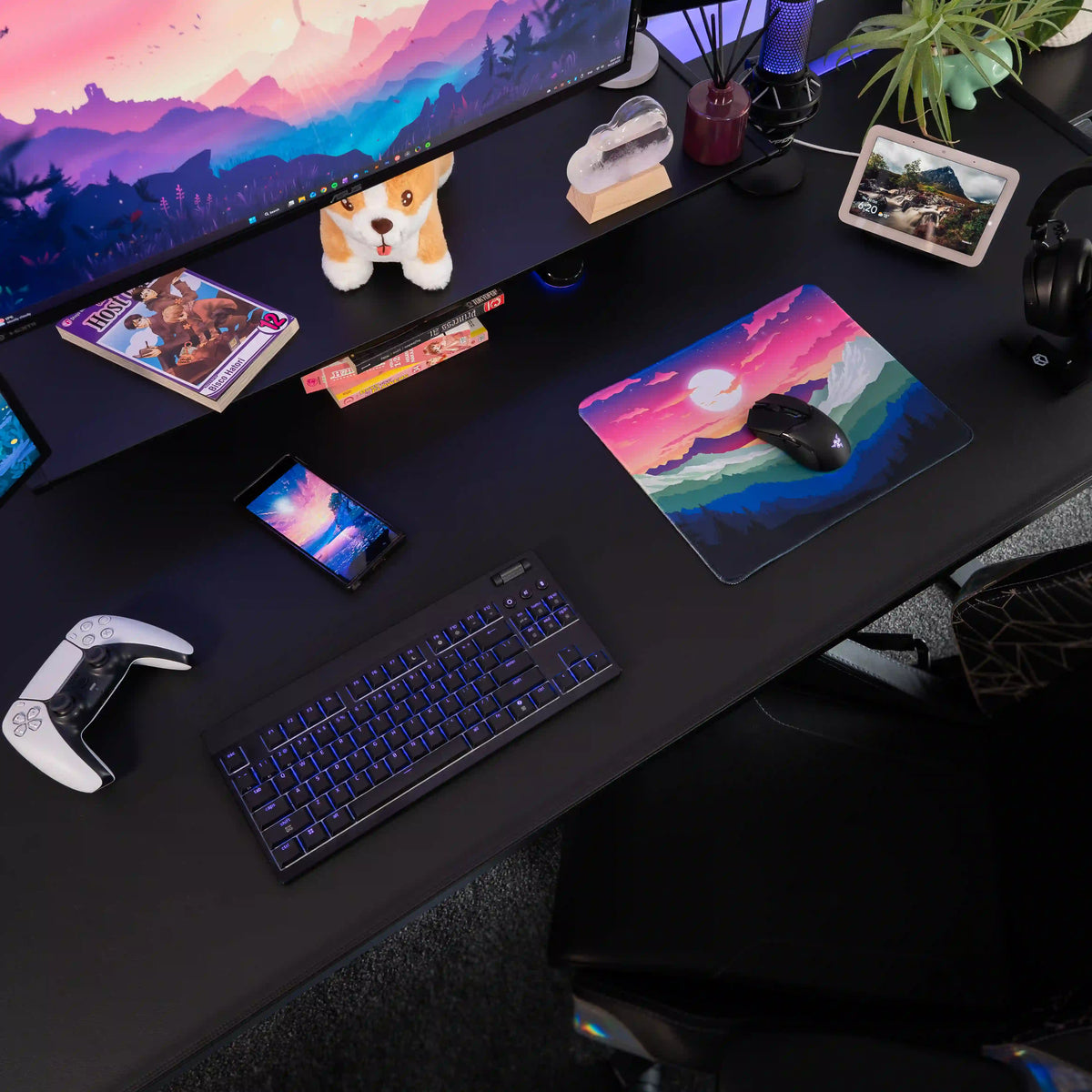Small ArcaLoot gaming mousepad with a mountain and sunset rainbow design on a black gaming setup. Rainbow Valley.