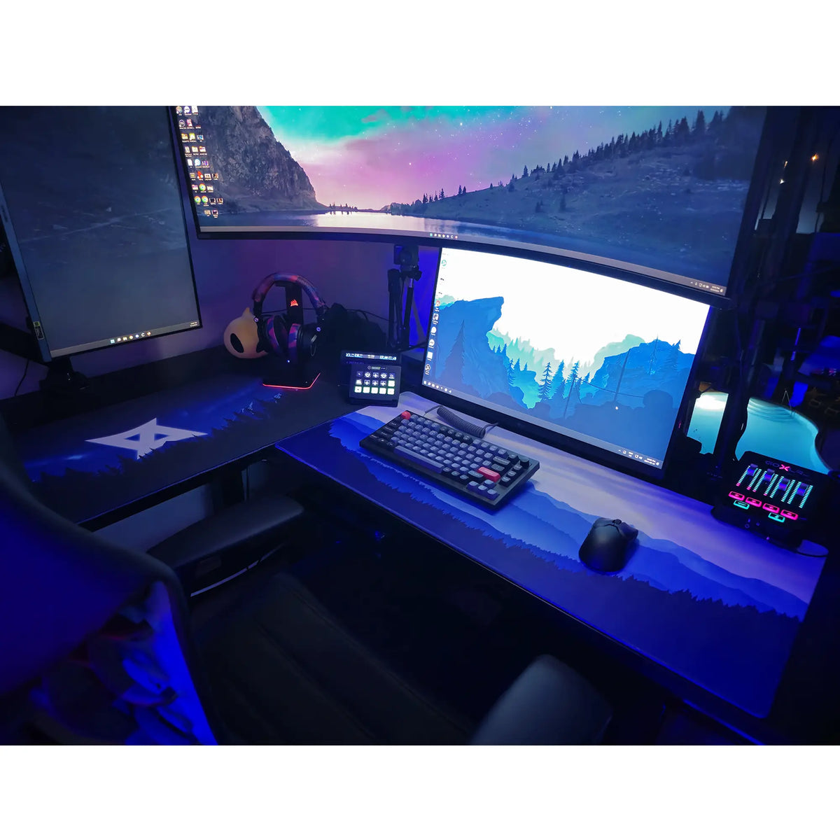 Large ArcaLoot gaming mousepad featuring blue mountains and a beautiful sky on a black gaming setup. Sapphire Summits.