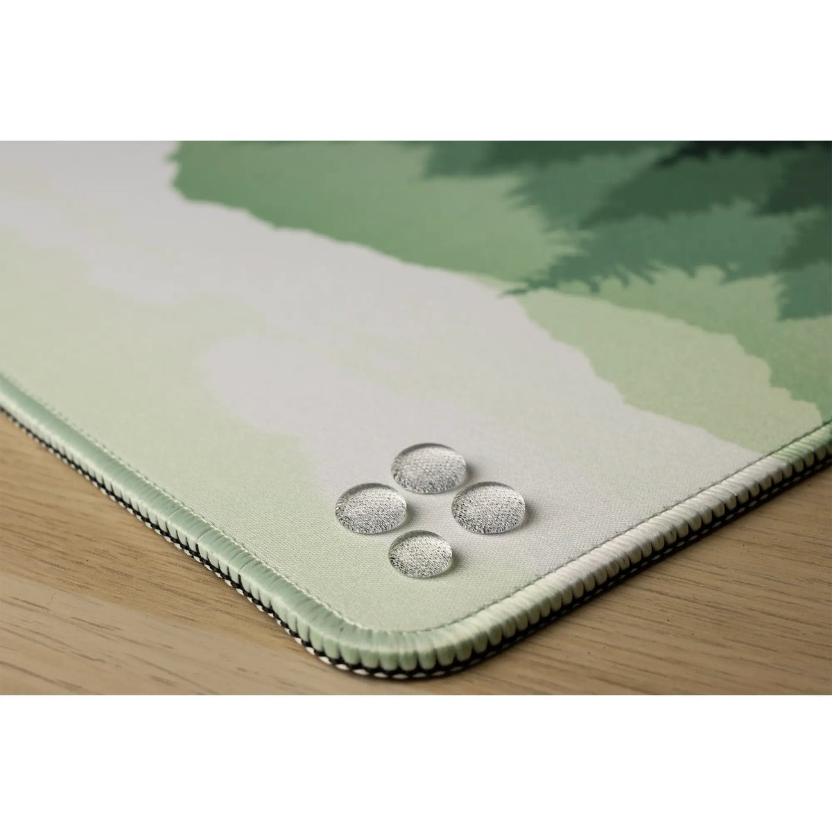 Clear water droplets on a green forest and mountains design. Wild Emerald.