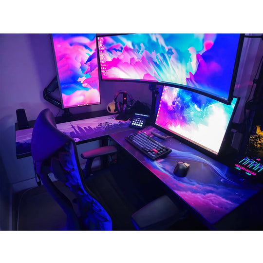 Large ArcaLoot gaming mousepad with a blue whale design against a colorful cosmic background on a black gaming desk. Cosmic Cetacean.