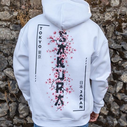 ArcaLoot Sakura white hoodie with vertical Sakura lettering and Japanese  cherry blossoms back design.