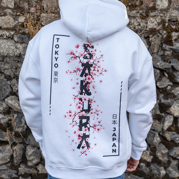 ArcaLoot Sakura white hoodie with vertical Sakura lettering and Japanese  cherry blossoms back design.