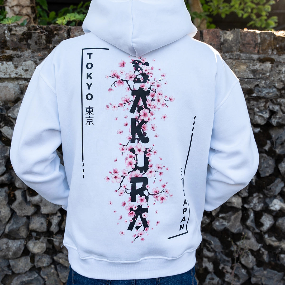 ArcaLoot Sakura white hoodie with vertical Sakura lettering and Japanese  cherry blossoms back design.