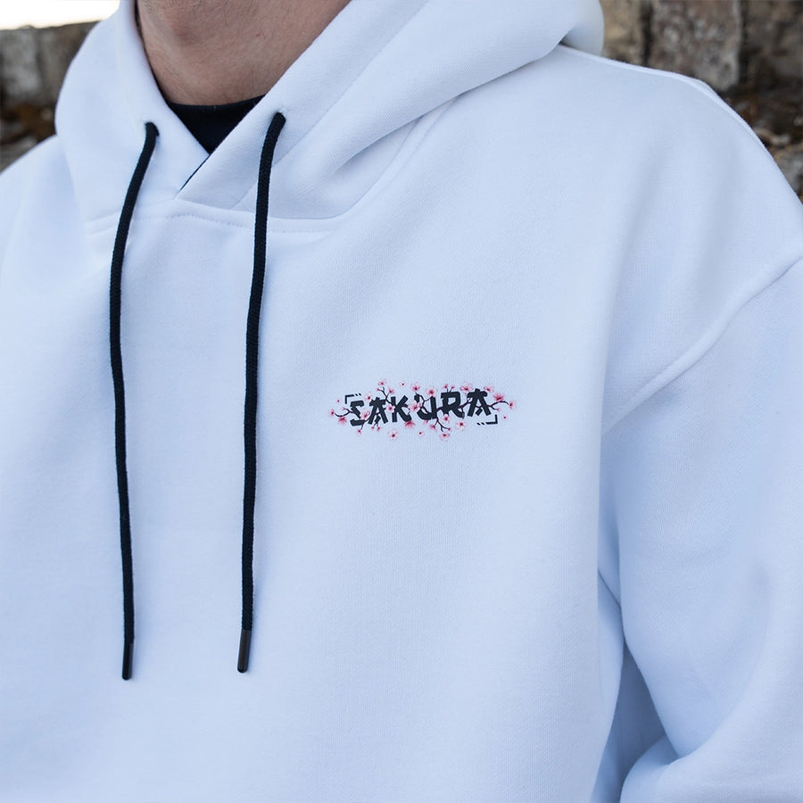 ArcaLoot Sakura white hoodie with cherry blossom front logo, sleeve artwork, black hood lining and drawstrings.