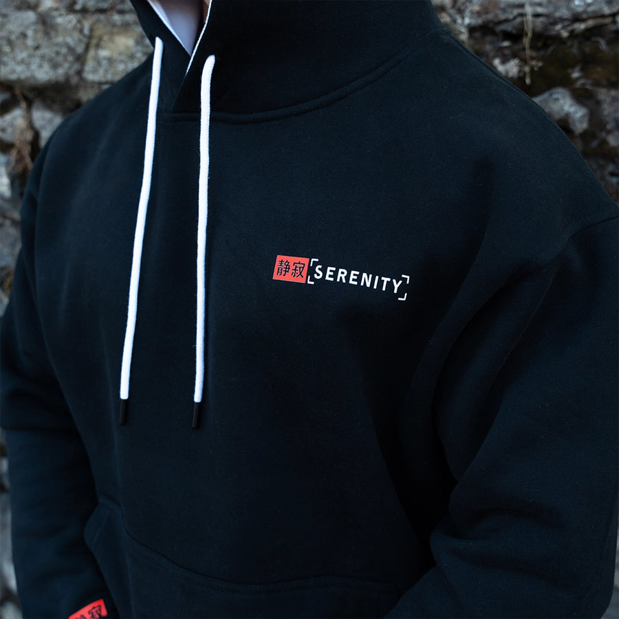 ArcaLoot Serenity black hoodie with Japanese and English front logo, white hood lining and drawstrings.