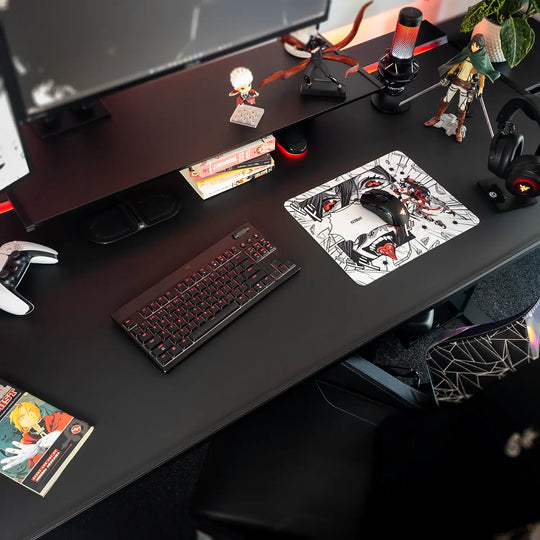 Desk setup with a small Arcaloot gaming mousepad featuring anime-style design. Cracked design.