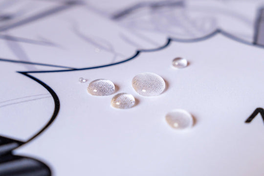 Clear water droplets on an Arcaloot gaming mousepad. Cracked design.