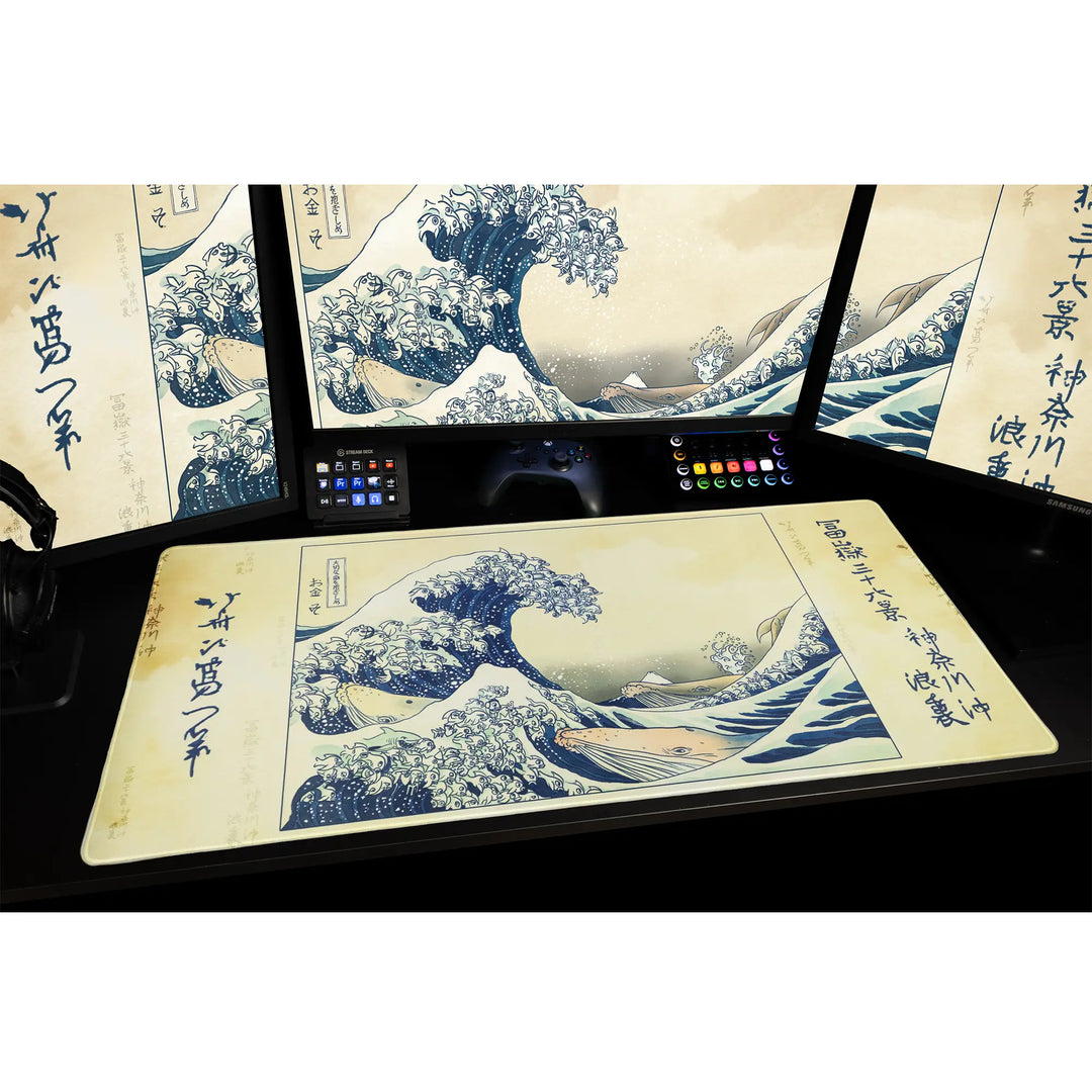 Large Arcaloot gaming mousepad featuring a fishy twist on the famous Kanagawa Wave on a black gaming.  setup. Kanagawa Fish Wave.