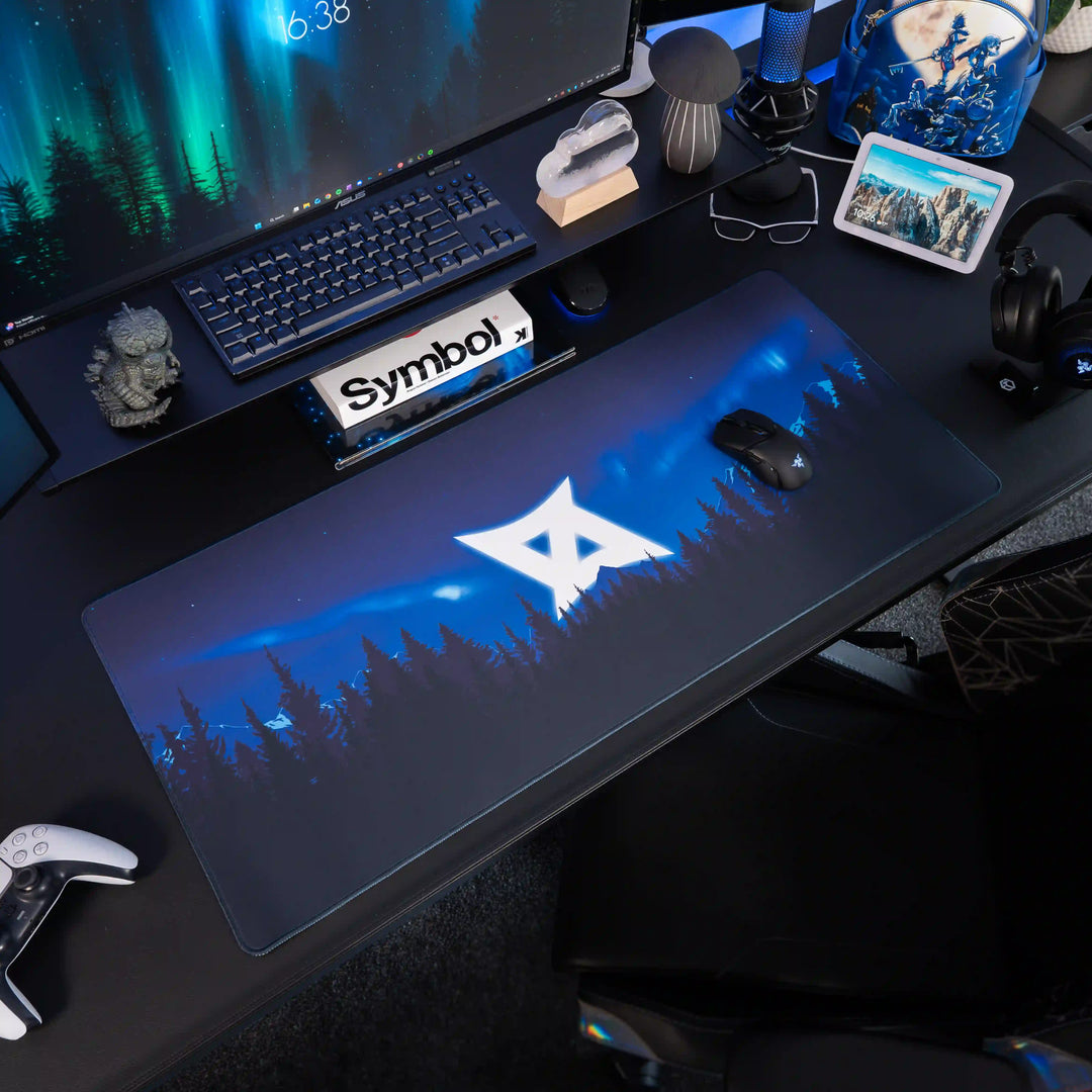 Large ArcaLoot gaming mousepad featuring AussieAntics logo and blue mountains on a black gaming setup. AussieAntics Alpine Aurora. 