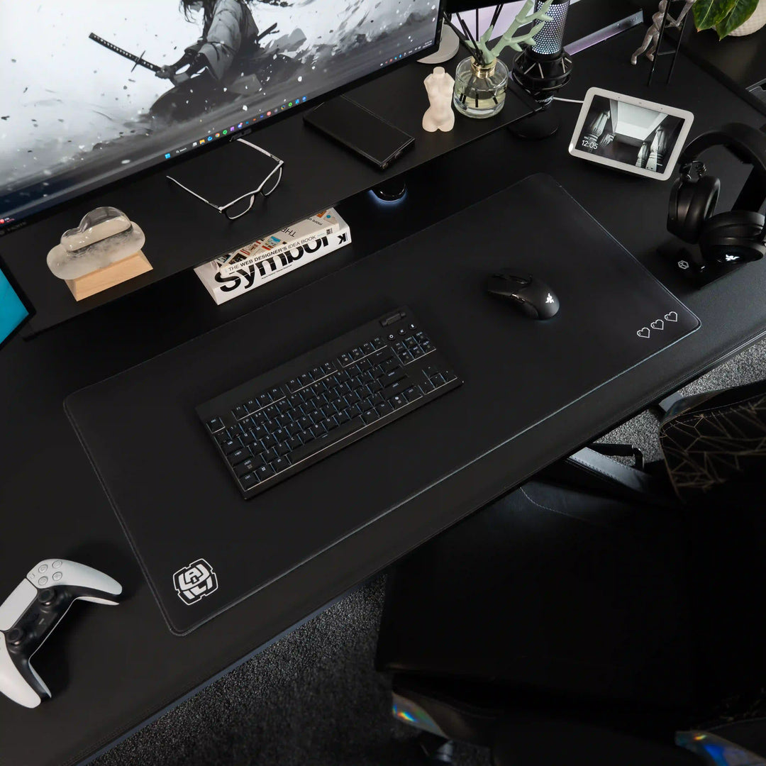 Large ArcaLoot gaming mousepad with Black and white logo design on a black gaming desk. Digital Hearts. Black Abyss.