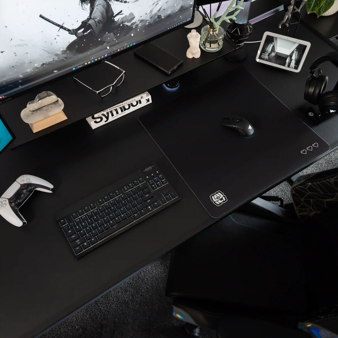 Medium ArcaLoot gaming mousepad with Black and white logo design on a black gaming desk. Digital Hearts. Black Abyss.