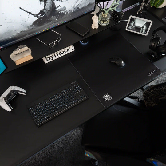 Medium ArcaLoot gaming mousepad with Black and white logo design on a black gaming desk. Digital Hearts. Black Abyss.