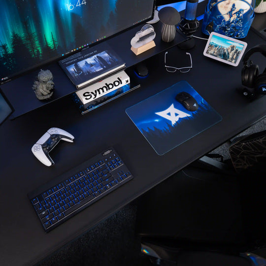 Small ArcaLoot gaming mousepad featuring AussieAntics logo and blue mountains on a black gaming setup. AussieAntics Alpine Aurora. 