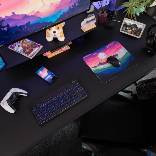Small ArcaLoot gaming mousepad with a mountain and sunset rainbow design on a black gaming setup. Rainbow Valley. 