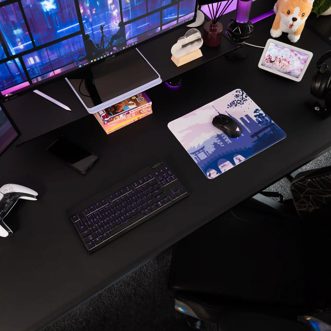 Small ArcaLoot Gaming mousepad with a Japanese-themed design featuring a purple and white design on a black gaming setup. Sakura Cityscape.