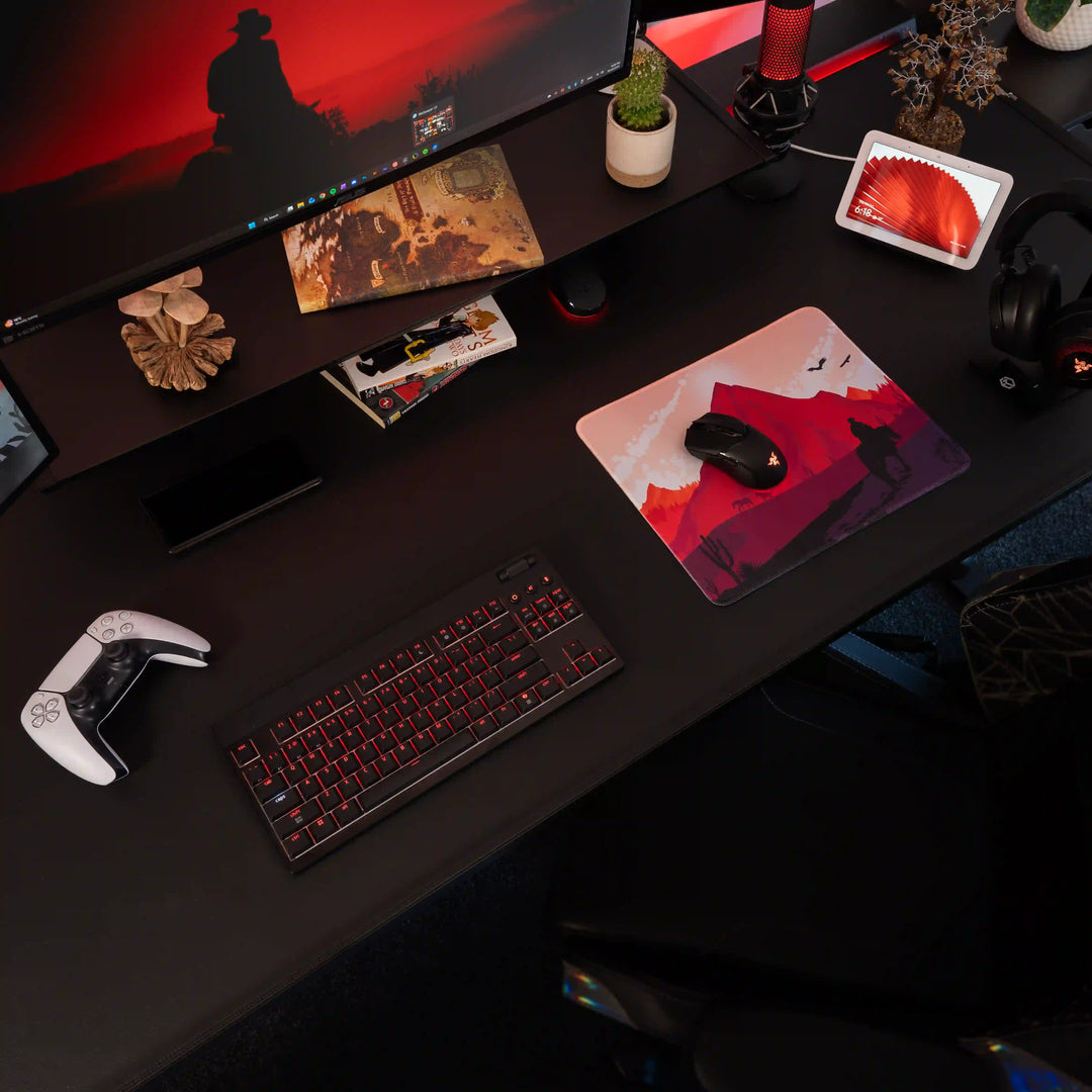 Small ArcaLoot Gaming Mousepad featuring a western desert landscape design on a black gaming setup. Sunset Wrangler.