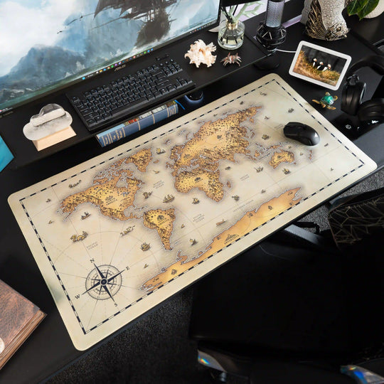 Decorative desk setup with a Extra Large Arcaloot gaming mousepad featuring a world map design. Unchartered Earth. Fantasy Map.