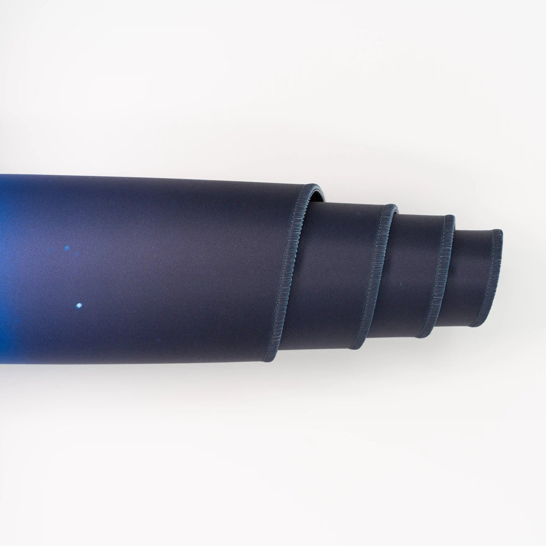 ArcaLoot Gaming Mousepad curled to show premium stitched edges - AussieAntics Alpine Aurora