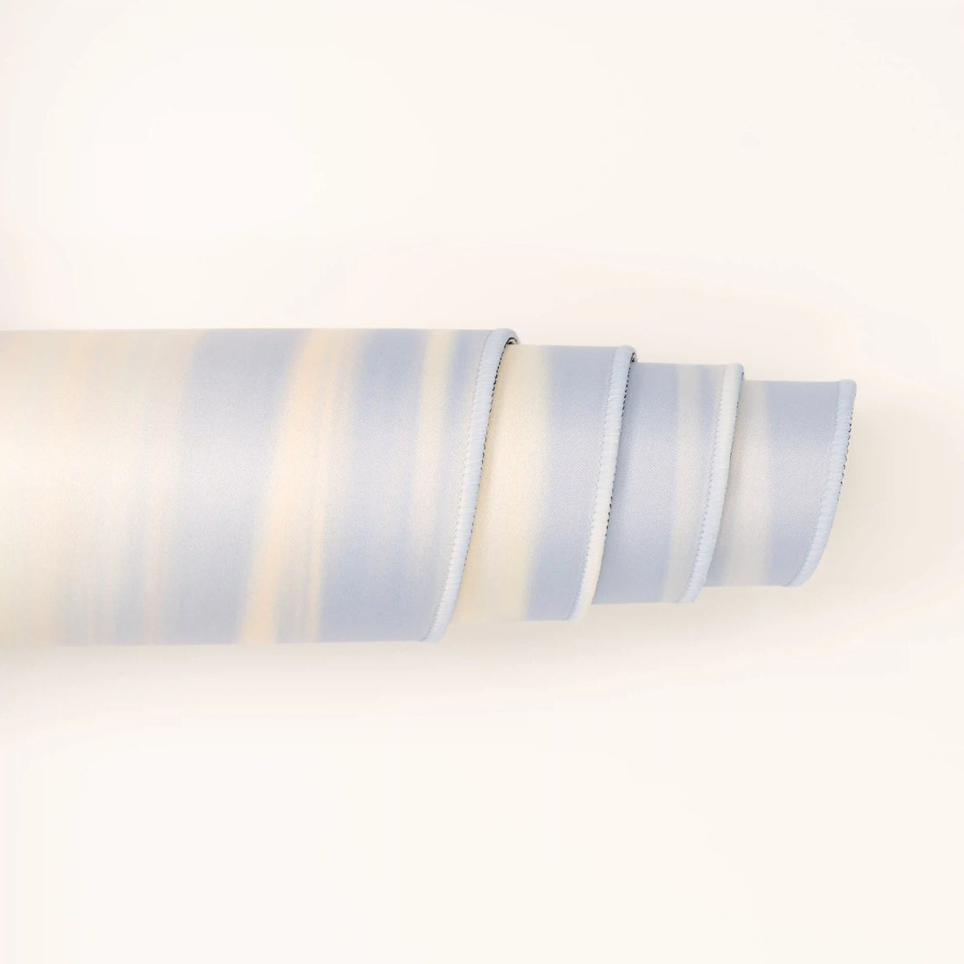 ArcaLoot Gaming Mousepad curled to show premium stitched edges - Sapphire Summits