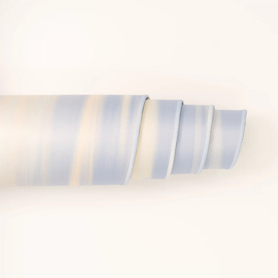 ArcaLoot Gaming Mousepad curled to show premium stitched edges - Sapphire Summits