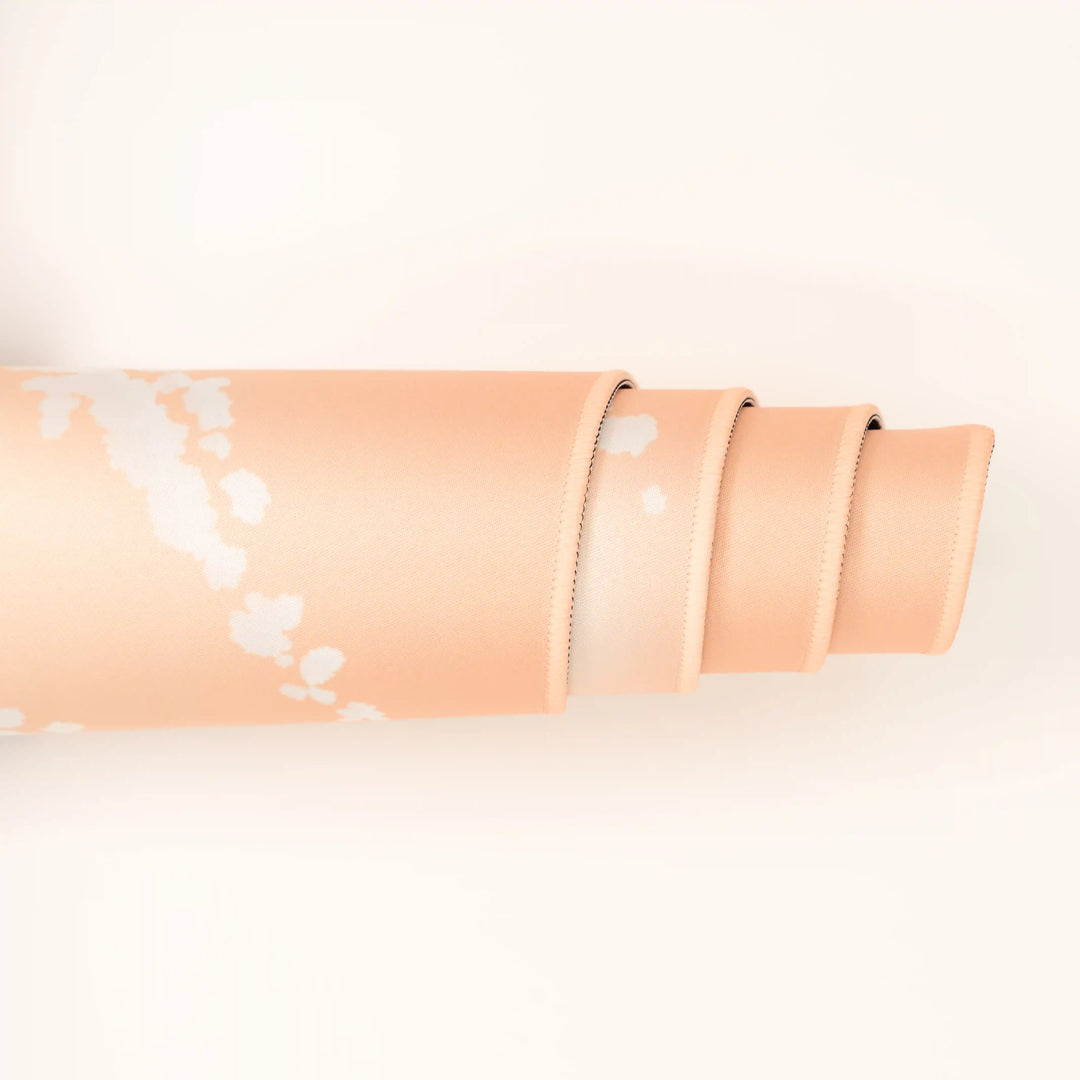 ArcaLoot Gaming Mousepad curled to show premium stitched edges - Sunset Wrangler