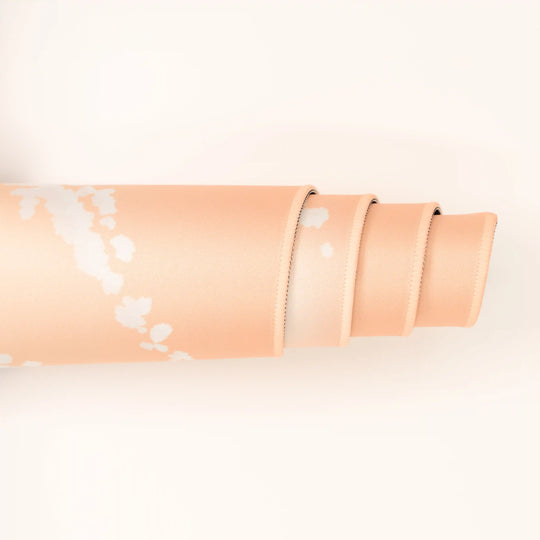 ArcaLoot Gaming Mousepad curled to show premium stitched edges - Sunset Wrangler