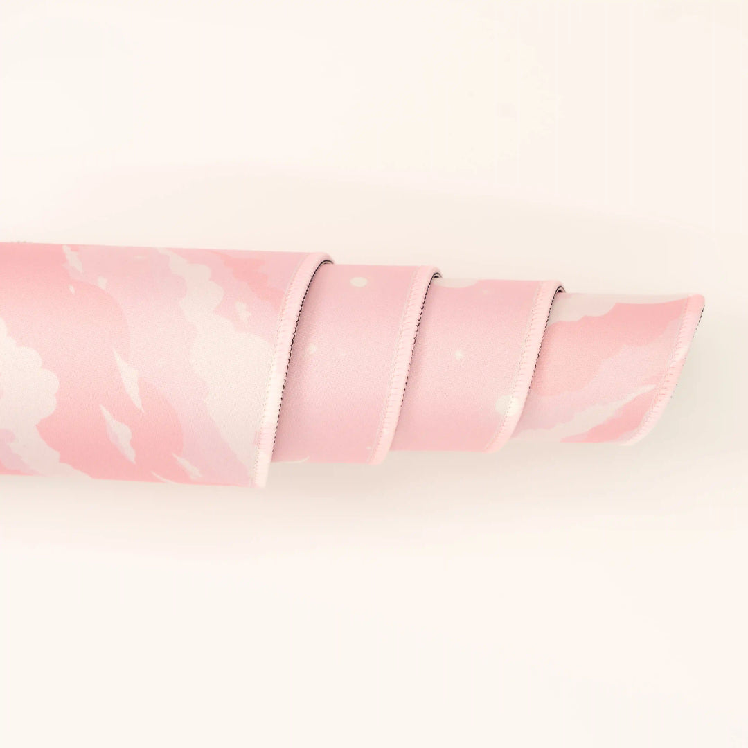 ArcaLoot Gaming Mousepad curled to show premium stitched edges - Pink Dreams