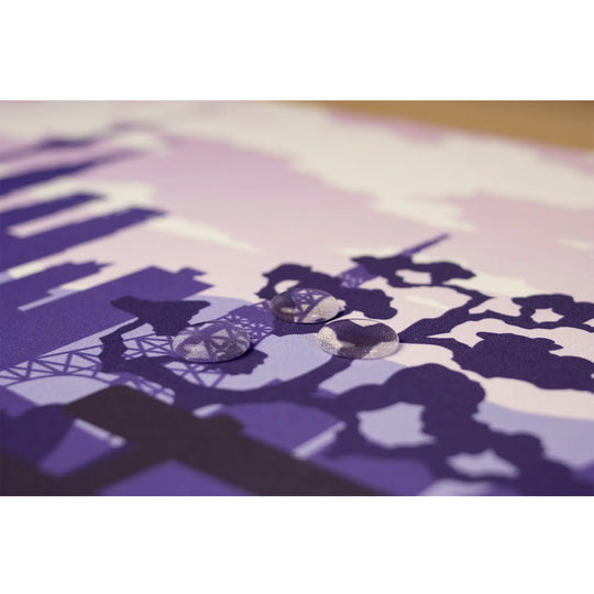 Clear water droplets on a Arcaloot purple gaming mousepad. Sakura Cityscape.